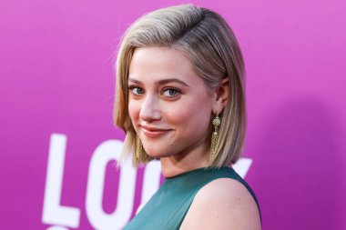 American actress Lili Reinhart wearing Miu Miu arrives at the Los Angeles Premiere Of Netflix's 'Look Both Ways' held at the Netflix Tudum Theater on August 16, 2022 in Hollywood, Los Angeles, California, United States. 