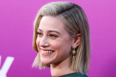 American actress Lili Reinhart wearing Miu Miu arrives at the Los Angeles Premiere Of Netflix's 'Look Both Ways' held at the Netflix Tudum Theater on August 16, 2022 in Hollywood, Los Angeles, California, United States. 