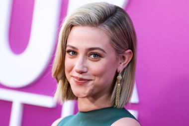 American actress Lili Reinhart wearing Miu Miu arrives at the Los Angeles Premiere Of Netflix's 'Look Both Ways' held at the Netflix Tudum Theater on August 16, 2022 in Hollywood, Los Angeles, California, United States. 