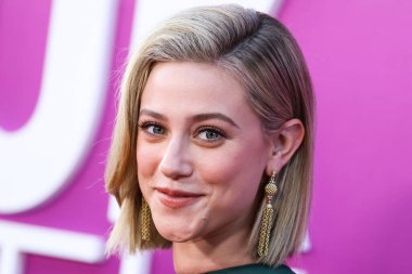 American actress Lili Reinhart wearing Miu Miu is interviewed by Entertainment Tonight (ET) at the Los Angeles Premiere Of Netflix's 'Look Both Ways' held at the Netflix Tudum Theater on August 16, 2022 in Hollywood, Los Angeles, California