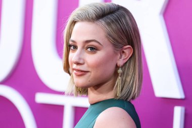 American actress Lili Reinhart wearing Miu Miu is interviewed by Entertainment Tonight (ET) at the Los Angeles Premiere Of Netflix's 'Look Both Ways' held at the Netflix Tudum Theater on August 16, 2022 in Hollywood, Los Angeles, California
