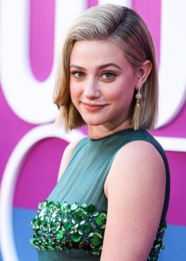 American actress Lili Reinhart wearing Miu Miu is interviewed by Entertainment Tonight (ET) at the Los Angeles Premiere Of Netflix's 'Look Both Ways' held at the Netflix Tudum Theater on August 16, 2022 in Hollywood, Los Angeles, California
