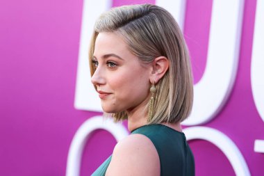 American actress Lili Reinhart wearing Miu Miu is interviewed by Entertainment Tonight (ET) at the Los Angeles Premiere Of Netflix's 'Look Both Ways' held at the Netflix Tudum Theater on August 16, 2022 in Hollywood, Los Angeles, California