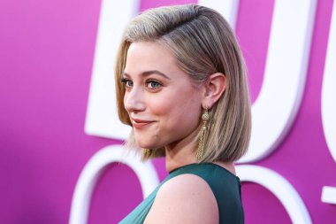 American actress Lili Reinhart wearing Miu Miu is interviewed by Entertainment Tonight (ET) at the Los Angeles Premiere Of Netflix's 'Look Both Ways' held at the Netflix Tudum Theater on August 16, 2022 in Hollywood, Los Angeles, California