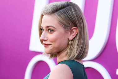 American actress Lili Reinhart wearing Miu Miu is interviewed by Entertainment Tonight (ET) at the Los Angeles Premiere Of Netflix's 'Look Both Ways' held at the Netflix Tudum Theater on August 16, 2022 in Hollywood, Los Angeles, California