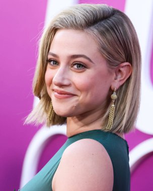 American actress Lili Reinhart wearing Miu Miu is interviewed by Entertainment Tonight (ET) at the Los Angeles Premiere Of Netflix's 'Look Both Ways' held at the Netflix Tudum Theater on August 16, 2022 in Hollywood, Los Angeles, California