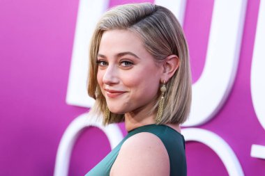 American actress Lili Reinhart wearing Miu Miu is interviewed by Entertainment Tonight (ET) at the Los Angeles Premiere Of Netflix's 'Look Both Ways' held at the Netflix Tudum Theater on August 16, 2022 in Hollywood, Los Angeles, California