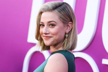 American actress Lili Reinhart wearing Miu Miu is interviewed by Entertainment Tonight (ET) at the Los Angeles Premiere Of Netflix's 'Look Both Ways' held at the Netflix Tudum Theater on August 16, 2022 in Hollywood, Los Angeles, California