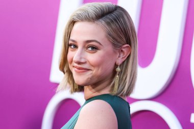 American actress Lili Reinhart wearing Miu Miu is interviewed by Entertainment Tonight (ET) at the Los Angeles Premiere Of Netflix's 'Look Both Ways' held at the Netflix Tudum Theater on August 16, 2022 in Hollywood, Los Angeles, California