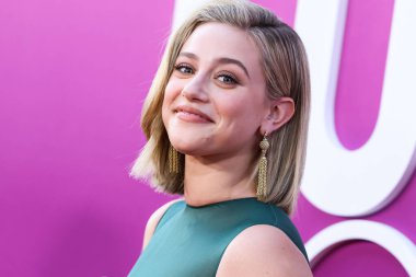 American actress Lili Reinhart wearing Miu Miu is interviewed by Entertainment Tonight (ET) at the Los Angeles Premiere Of Netflix's 'Look Both Ways' held at the Netflix Tudum Theater on August 16, 2022 in Hollywood, Los Angeles, California
