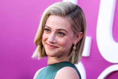 American actress Lili Reinhart wearing Miu Miu is interviewed by Entertainment Tonight (ET) at the Los Angeles Premiere Of Netflix's 'Look Both Ways' held at the Netflix Tudum Theater on August 16, 2022 in Hollywood, Los Angeles, California