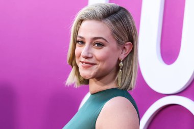 American actress Lili Reinhart wearing Miu Miu is interviewed by Entertainment Tonight (ET) at the Los Angeles Premiere Of Netflix's 'Look Both Ways' held at the Netflix Tudum Theater on August 16, 2022 in Hollywood, Los Angeles, California