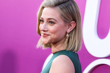 American actress Lili Reinhart wearing Miu Miu is interviewed by Entertainment Tonight (ET) at the Los Angeles Premiere Of Netflix's 'Look Both Ways' held at the Netflix Tudum Theater on August 16, 2022 in Hollywood, Los Angeles, California