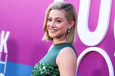 American actress Lili Reinhart wearing Miu Miu is interviewed by Entertainment Tonight (ET) at the Los Angeles Premiere Of Netflix's 'Look Both Ways' held at the Netflix Tudum Theater on August 16, 2022 in Hollywood, Los Angeles, California