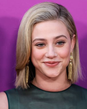 American actress Lili Reinhart wearing Miu Miu is interviewed by Entertainment Tonight (ET) at the Los Angeles Premiere Of Netflix's 'Look Both Ways' held at the Netflix Tudum Theater on August 16, 2022 in Hollywood, Los Angeles, California