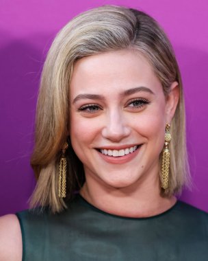 American actress Lili Reinhart wearing Miu Miu is interviewed by Entertainment Tonight (ET) at the Los Angeles Premiere Of Netflix's 'Look Both Ways' held at the Netflix Tudum Theater on August 16, 2022 in Hollywood, Los Angeles, California