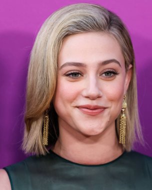 American actress Lili Reinhart wearing Miu Miu is interviewed by Entertainment Tonight (ET) at the Los Angeles Premiere Of Netflix's 'Look Both Ways' held at the Netflix Tudum Theater on August 16, 2022 in Hollywood, Los Angeles, California