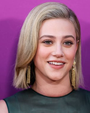 American actress Lili Reinhart wearing Miu Miu is interviewed by Entertainment Tonight (ET) at the Los Angeles Premiere Of Netflix's 'Look Both Ways' held at the Netflix Tudum Theater on August 16, 2022 in Hollywood, Los Angeles, California