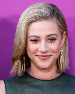 American actress Lili Reinhart wearing Miu Miu is interviewed by Entertainment Tonight (ET) at the Los Angeles Premiere Of Netflix's 'Look Both Ways' held at the Netflix Tudum Theater on August 16, 2022 in Hollywood, Los Angeles, California