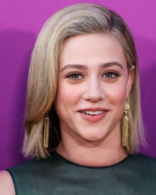 American actress Lili Reinhart wearing Miu Miu arrives at the Los Angeles Premiere Of Netflix's 'Look Both Ways' held at the Netflix Tudum Theater on August 16, 2022 in Hollywood, Los Angeles, California, United States. 