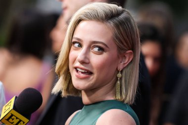 American actress Lili Reinhart wearing Miu Miu arrives at the Los Angeles Premiere Of Netflix's 'Look Both Ways' held at the Netflix Tudum Theater on August 16, 2022 in Hollywood, Los Angeles, California, United States. 