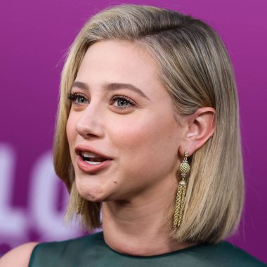 American actress Lili Reinhart wearing Miu Miu arrives at the Los Angeles Premiere Of Netflix's 'Look Both Ways' held at the Netflix Tudum Theater on August 16, 2022 in Hollywood, Los Angeles, California, United States. 