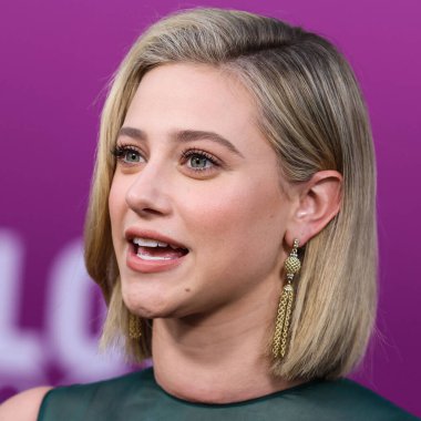American actress Lili Reinhart wearing Miu Miu arrives at the Los Angeles Premiere Of Netflix's 'Look Both Ways' held at the Netflix Tudum Theater on August 16, 2022 in Hollywood, Los Angeles, California, United States. 