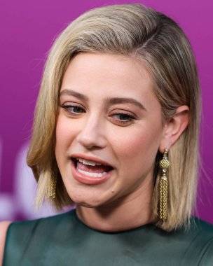 American actress Lili Reinhart wearing Miu Miu arrives at the Los Angeles Premiere Of Netflix's 'Look Both Ways' held at the Netflix Tudum Theater on August 16, 2022 in Hollywood, Los Angeles, California, United States. 