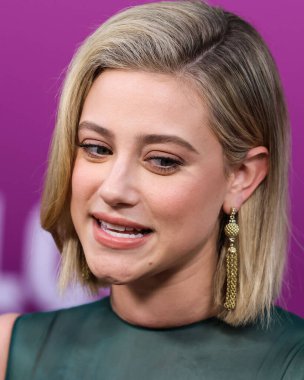 American actress Lili Reinhart wearing Miu Miu arrives at the Los Angeles Premiere Of Netflix's 'Look Both Ways' held at the Netflix Tudum Theater on August 16, 2022 in Hollywood, Los Angeles, California, United States. 