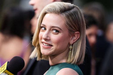 American actress Lili Reinhart wearing Miu Miu is interviewed by Entertainment Tonight (ET) at the Los Angeles Premiere Of Netflix's 'Look Both Ways' held at the Netflix Tudum Theater on August 16, 2022 in Hollywood, Los Angeles, California