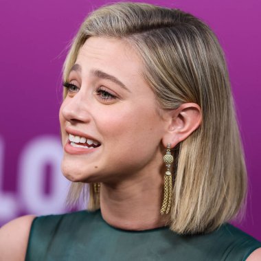 American actress Lili Reinhart wearing Miu Miu arrives at the Los Angeles Premiere Of Netflix's 'Look Both Ways' held at the Netflix Tudum Theater on August 16, 2022 in Hollywood, Los Angeles, California, United States. 