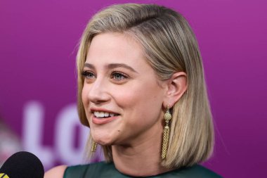 American actress Lili Reinhart wearing Miu Miu arrives at the Los Angeles Premiere Of Netflix's 'Look Both Ways' held at the Netflix Tudum Theater on August 16, 2022 in Hollywood, Los Angeles, California, United States. 