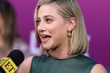 American actress Lili Reinhart wearing Miu Miu arrives at the Los Angeles Premiere Of Netflix's 'Look Both Ways' held at the Netflix Tudum Theater on August 16, 2022 in Hollywood, Los Angeles, California, United States. 