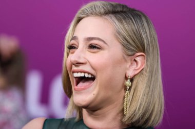 American actress Lili Reinhart wearing Miu Miu arrives at the Los Angeles Premiere Of Netflix's 'Look Both Ways' held at the Netflix Tudum Theater on August 16, 2022 in Hollywood, Los Angeles, California, United States. 