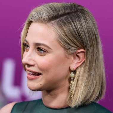 American actress Lili Reinhart wearing Miu Miu arrives at the Los Angeles Premiere Of Netflix's 'Look Both Ways' held at the Netflix Tudum Theater on August 16, 2022 in Hollywood, Los Angeles, California, United States. 