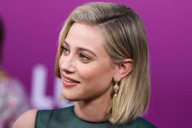 American actress Lili Reinhart wearing Miu Miu arrives at the Los Angeles Premiere Of Netflix's 'Look Both Ways' held at the Netflix Tudum Theater on August 16, 2022 in Hollywood, Los Angeles, California, United States. 