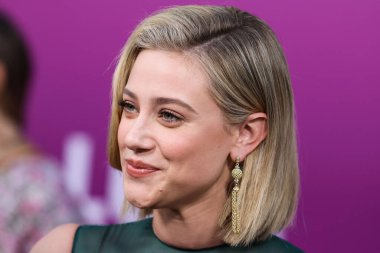 American actress Lili Reinhart wearing Miu Miu is interviewed by Entertainment Tonight (ET) at the Los Angeles Premiere Of Netflix's 'Look Both Ways' held at the Netflix Tudum Theater on August 16, 2022 in Hollywood, Los Angeles, California