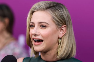 American actress Lili Reinhart wearing Miu Miu is interviewed by Entertainment Tonight (ET) at the Los Angeles Premiere Of Netflix's 'Look Both Ways' held at the Netflix Tudum Theater on August 16, 2022 in Hollywood, Los Angeles, California