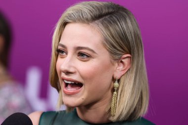 American actress Lili Reinhart wearing Miu Miu is interviewed by Entertainment Tonight (ET) at the Los Angeles Premiere Of Netflix's 'Look Both Ways' held at the Netflix Tudum Theater on August 16, 2022 in Hollywood, Los Angeles, California