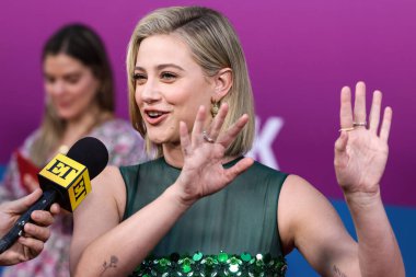 American actress Lili Reinhart wearing Miu Miu is interviewed by Entertainment Tonight (ET) at the Los Angeles Premiere Of Netflix's 'Look Both Ways' held at the Netflix Tudum Theater on August 16, 2022 in Hollywood, Los Angeles, California