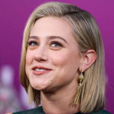 American actress Lili Reinhart wearing Miu Miu is interviewed by Entertainment Tonight (ET) at the Los Angeles Premiere Of Netflix's 'Look Both Ways' held at the Netflix Tudum Theater on August 16, 2022 in Hollywood, Los Angeles, California