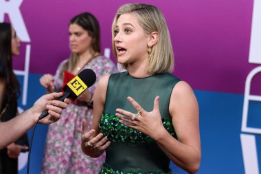 American actress Lili Reinhart wearing Miu Miu is interviewed by Entertainment Tonight (ET) at the Los Angeles Premiere Of Netflix's 'Look Both Ways' held at the Netflix Tudum Theater on August 16, 2022 in Hollywood, Los Angeles, California
