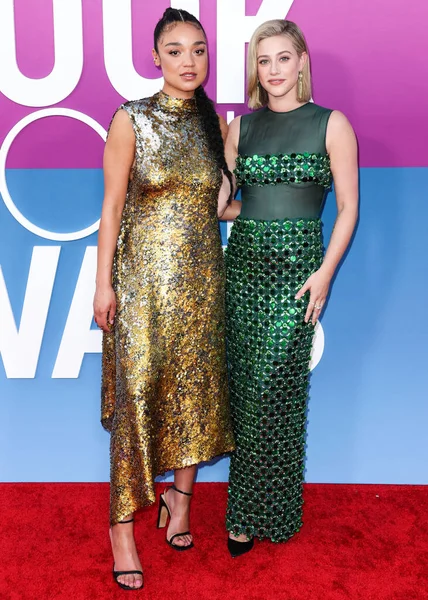 Australian actress Aisha Dee and American actress Lili Reinhart wearing Miu Miu arrive at the Los Angeles Premiere Of Netflix's 'Look Both Ways' held at the Netflix Tudum Theater on August 16, 2022 in Hollywood, Los Angeles, California, United States