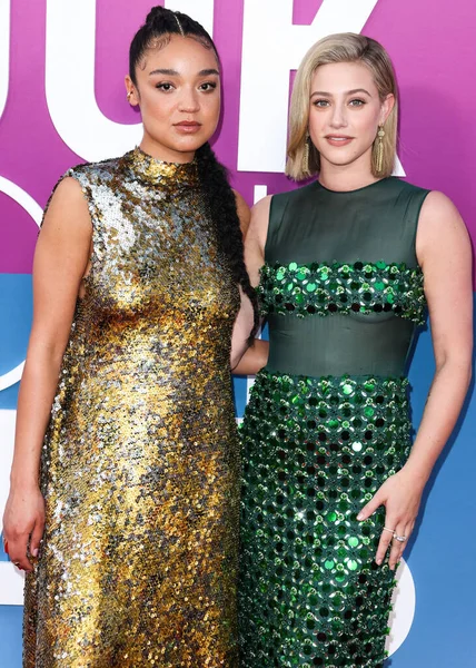 Australian actress Aisha Dee and American actress Lili Reinhart wearing Miu Miu arrive at the Los Angeles Premiere Of Netflix's 'Look Both Ways' held at the Netflix Tudum Theater on August 16, 2022 in Hollywood, Los Angeles, California, United States