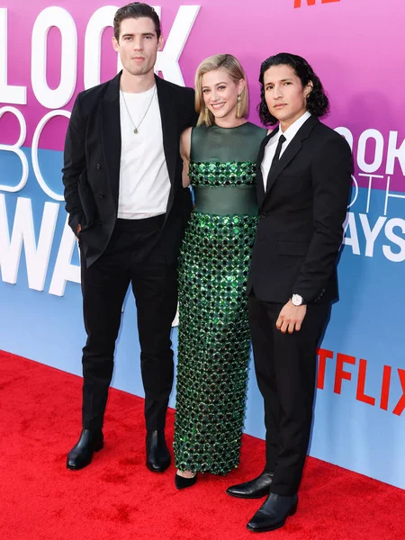 American actor David Corenswet, American actress Lili Reinhart wearing Miu Miu and American actor Danny Ramirez arrive at the Los Angeles Premiere Of Netflix's 'Look Both Ways' held at the Netflix Tudum Theater on August 16, 2022 in Hollywood