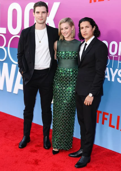 American actor David Corenswet, American actress Lili Reinhart wearing Miu Miu and American actor Danny Ramirez arrive at the Los Angeles Premiere Of Netflix's 'Look Both Ways' held at the Netflix Tudum Theater on August 16, 2022 in Hollywood