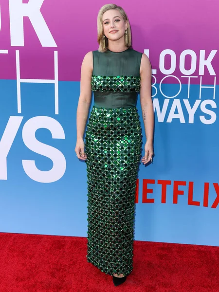 American actress Lili Reinhart wearing Miu Miu arrives at the Los Angeles Premiere Of Netflix's 'Look Both Ways' held at the Netflix Tudum Theater on August 16, 2022 in Hollywood, Los Angeles, California, United States. 
