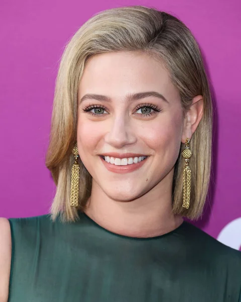 American actress Lili Reinhart wearing Miu Miu arrives at the Los Angeles Premiere Of Netflix's 'Look Both Ways' held at the Netflix Tudum Theater on August 16, 2022 in Hollywood, Los Angeles, California, United States. 