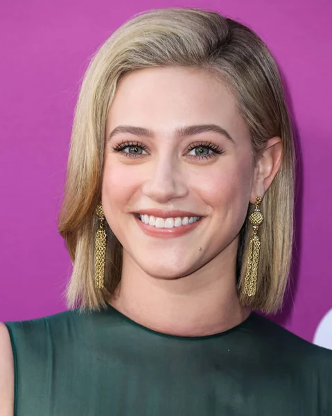 American actress Lili Reinhart wearing Miu Miu arrives at the Los Angeles Premiere Of Netflix's 'Look Both Ways' held at the Netflix Tudum Theater on August 16, 2022 in Hollywood, Los Angeles, California, United States. 
