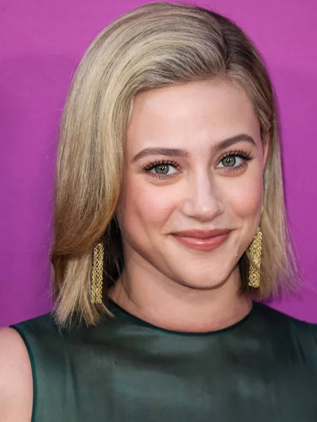 American actress Lili Reinhart wearing Miu Miu arrives at the Los Angeles Premiere Of Netflix's 'Look Both Ways' held at the Netflix Tudum Theater on August 16, 2022 in Hollywood, Los Angeles, California, United States. 